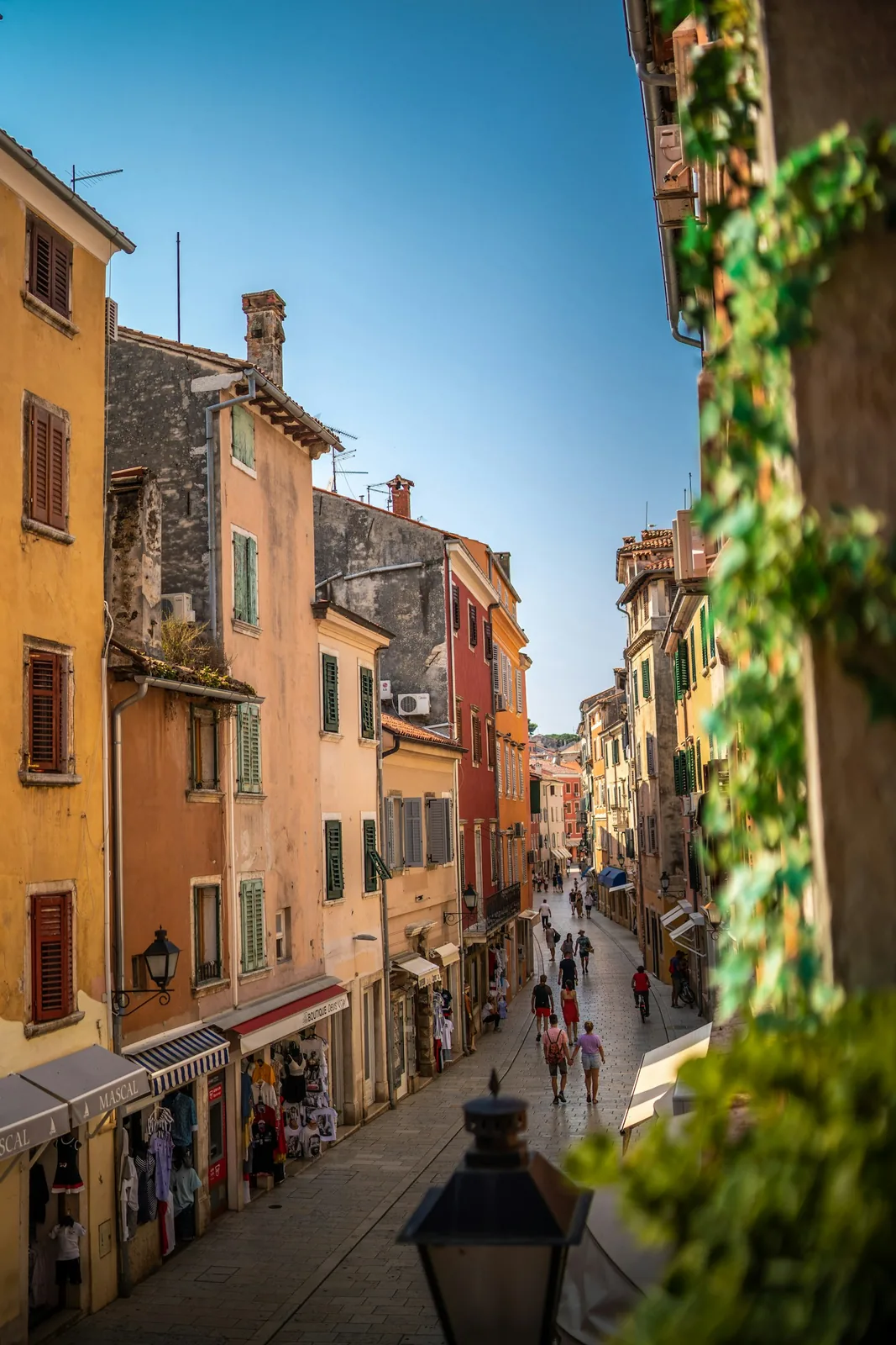 Carera, the pedestrian main street of Rovinj old town, lined with shops and colourful apartment houses