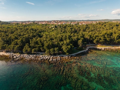Rocky Cuvi shore with Rovinj behind