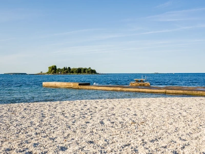 White pebble beach and open sea