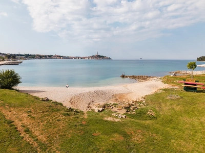 Pebble beach with the old town in the distance
