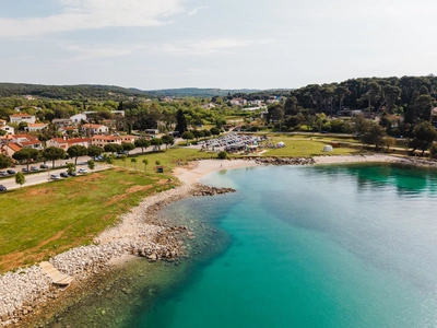 Smaller cove with grassy field and parking