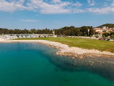 Aerial of the pebble shoreline next to the marina