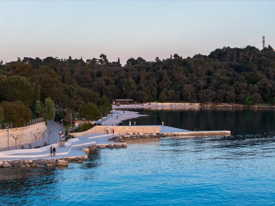 Dusk view of the promenade and swim area