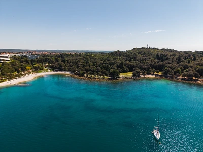 View across the bay with a sailboat at anchor