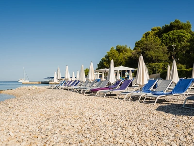 Loungers along the pebble shore