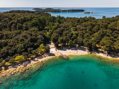 Pebble cove with the Rovinj archipelago beyond