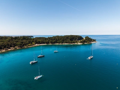 Yachts anchored in the calm waters of Lone Bay